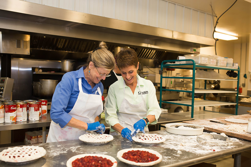 The Crane sisters make pies in the kitchen.